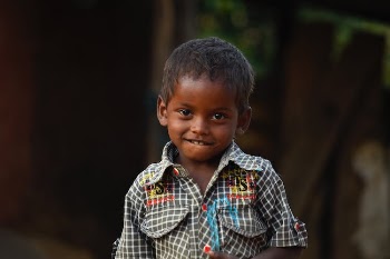 Boy Wearing White and Multicolored Collared Shirt in Selective Focus Photography