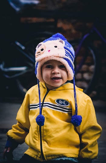 Boy Wearing Yellow Jacket and Chullo hat