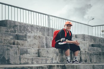 Boy With Skateboard On His Lap