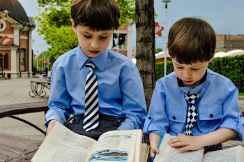Boys in Blue Shirts Reading Books