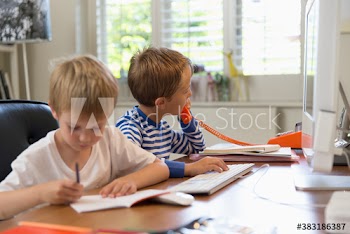 Boys pretend working in home office