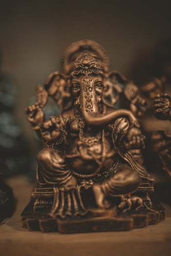 Brass-colored Lord Ganesha Figurine