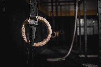 Brass-colored Ring With Black Strap
