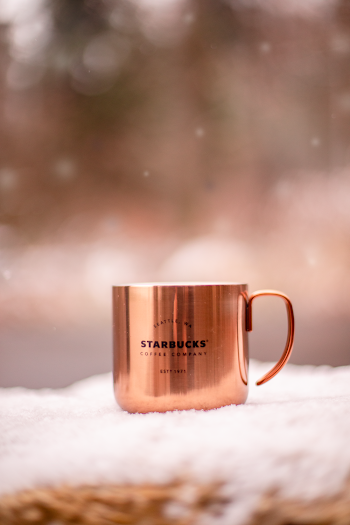Brass-colored Starbucks Mug on White Surface