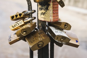 Brass Padlock on Black Metal Stand
