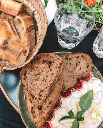 Bread on Plate Beside Glas
