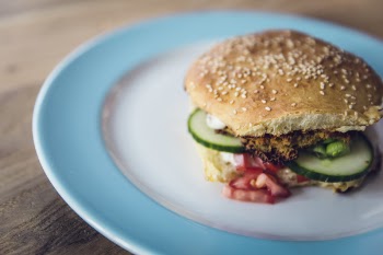 Bread With Sliced Green Vegetable and Meat on White and Blue Plate