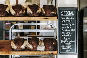 breads on brown wooden shelf