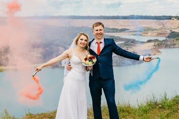Bride And Groom Holding Smoke Bombs