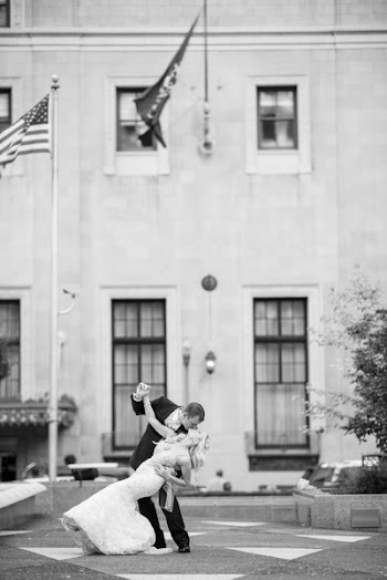 Bride and Groom Kissing Near Us Flag