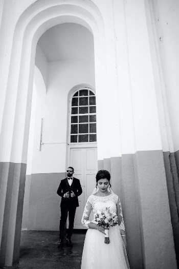 Bride and Groom near Church Building