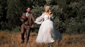 Bride and Groom Walking in Field