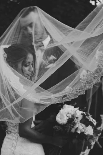 bride and groom with veil