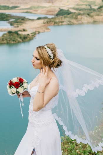 Bride Standing Near Body of Water
