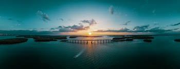 Bridge Near Body of Water during Golden Hour Wallpaper