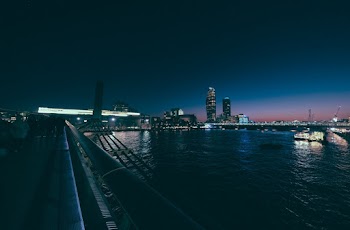 Bridge Near Buildings At Nighttime