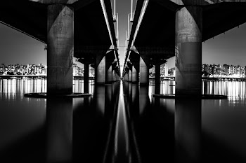Bridge on Body of Water in Grayscale Photography