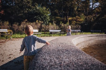 Brother and sister at a fountain