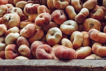 Brown and Beige Round Fruits on Brown Wooden Board