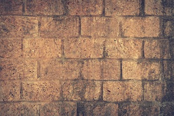 Brown and Black Brick Wall Close Up Shot Photography