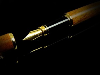 Brown and Black Fountain Pen on Black Surface