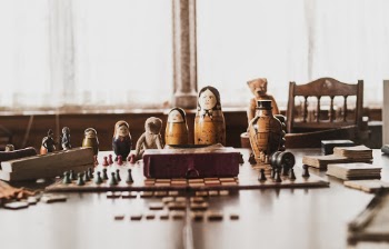 Brown-and-black Nesting Doll on Brown Wooden Table