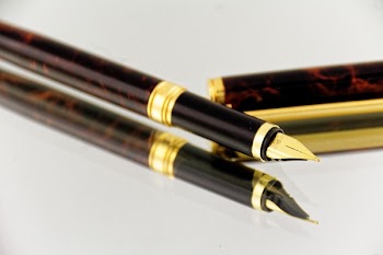 Brown and Black Quill Pen