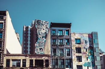 Brown and Gray High-rise Building With Paints