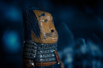 Brown and Gray Warrior Figure Closeup Photo