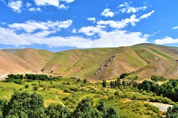 Brown and Green Mountain Range Under Blue Sky