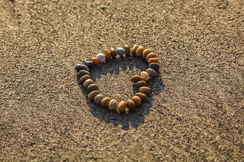 Brown and Grey Stone Formed Heart on Sand