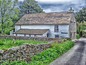 Brown and Grey Stone House Near Stone Fence Painting
