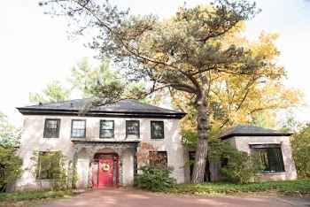 Brown and Red Concrete House Near Green-leafed Tree