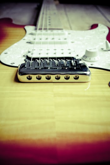 Brown and Red Electric Guitar