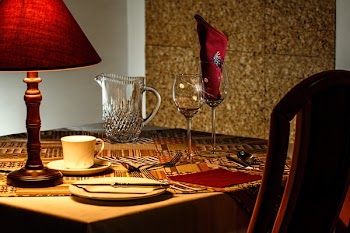 Brown and Red Table Lamp Near White Ceramic Mug
