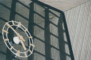 brown and white analog wall clock
