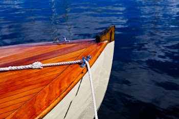 Brown and White Boat on Body of Water