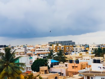 Brown and White City Buildings Under Gray Clouds