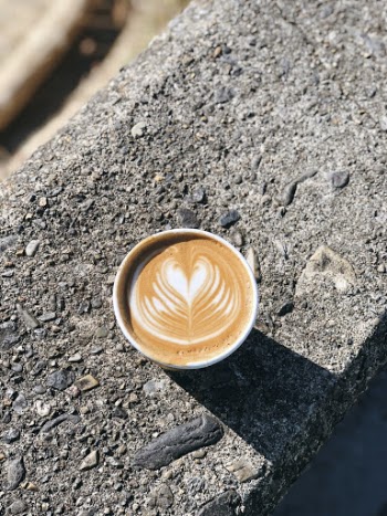 Brown and White Coffee With Cream on Gray Surface