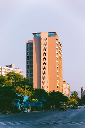 Brown and White Concrete Building Near Trees