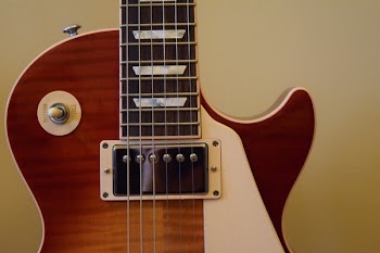 Brown and White Les Paul Guitar