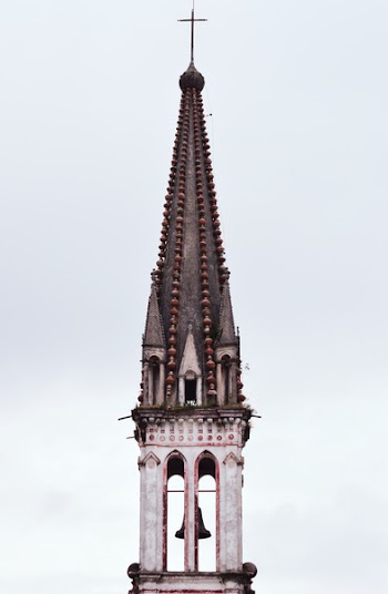 Brown and White Painted Church Bell Tower