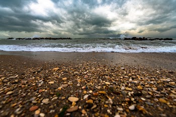 Brown And White Pebbles On Shore