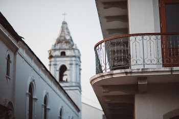 Brown Balustrade of Building Facing Cathedral