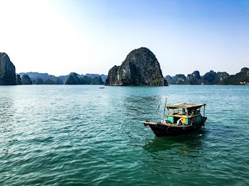 Brown Boat on Body of Water