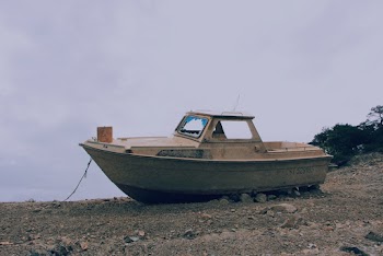 Brown Boat on Ground