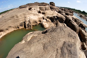Brown Boulder and Body of Water