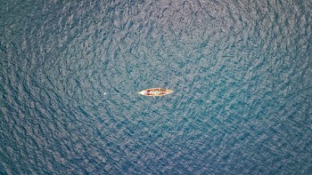 Brown Canoe on Body of Water