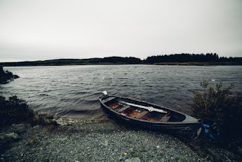 Brown Canoe on Shore