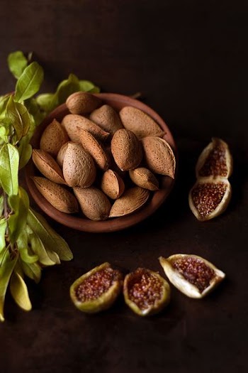 brown ceramic pot with nuts